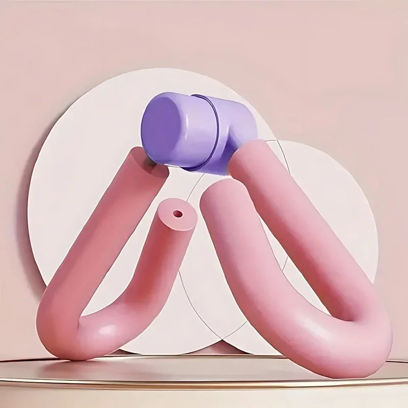 Pink and purple thigh toner fitness tool on a beige background, exercise equipment.