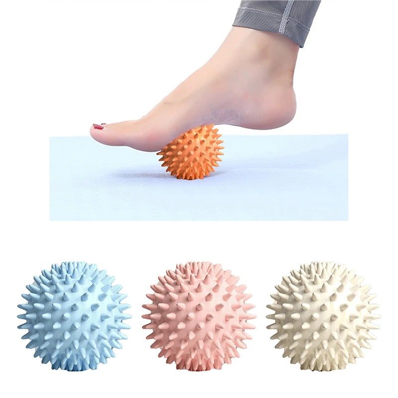 Foot massaging spiky ball for plantar fasciitis relief in assorted colors on yoga mat