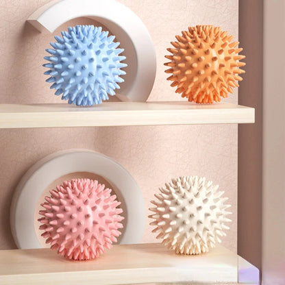 Colorful spiky massage balls for fitness therapy and muscle relaxation on shelves