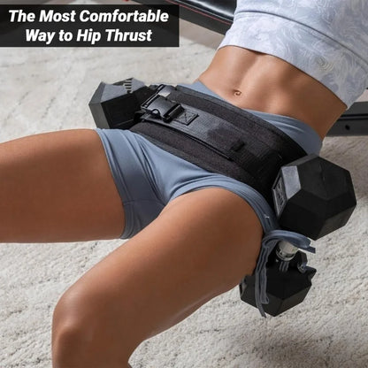 Woman using padded hip thrust belt with dumbbells for glute workout on fitness bench